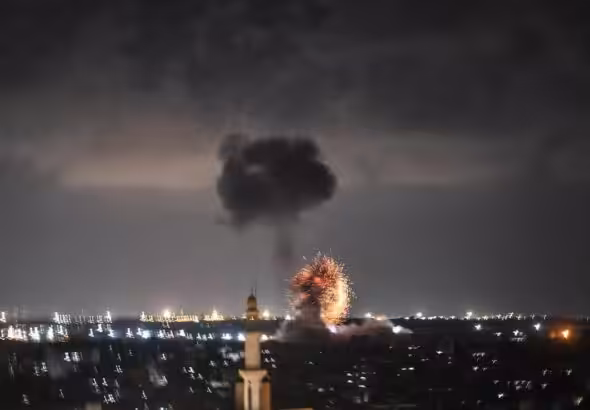 Explosion recorded over Gaza during a night Israeli air strike. Photo: Twitter/@bara_lafi.