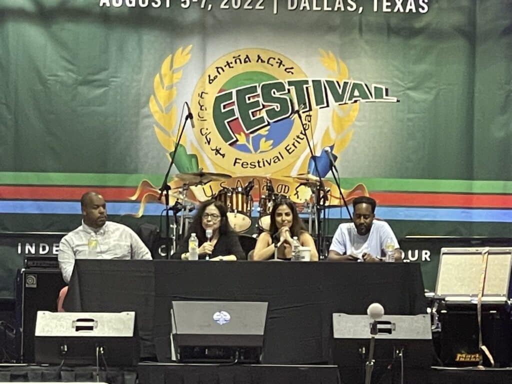 Eugene Puryear, author Ann Garrison, Rania Khalek, Dr. Simon Tesfamariam at the 48th annual Eritrea Festival in Dallas. Photo: Twitter @SebleTsehaye.