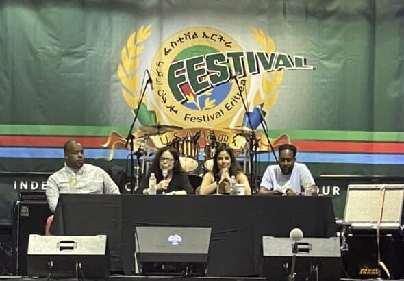 Eugene Puryear, author Ann Garrison, Rania Khalek, Dr. Simon Tesfamariam at the 48th annual Eritrea Festival in Dallas. Photo: Twitter @SebleTsehaye.