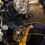 German Chancellor Olaf Scholz looks at the Siemens gas turbine intended for the Nord Stream 1 gas pipeline on August 3, 2022 in Muelheim an der Ruhr. Photo: Andreas Rentz/Getty Images.