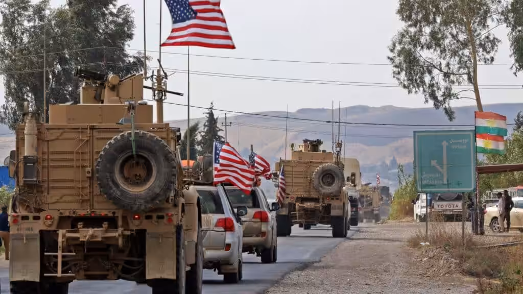 A US military convoy crossing from Syria into Iraq. Photo: USA Today.