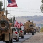 A US military convoy crossing from Syria into Iraq. Photo: USA Today.