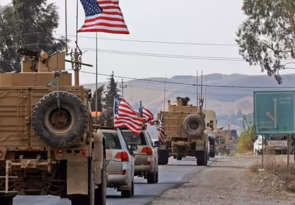 A US military convoy crossing from Syria into Iraq. Photo: USA Today.
