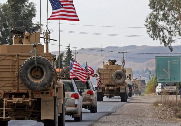 A US military convoy crossing from Syria into Iraq. Photo: USA Today.