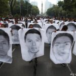Demonstration with protesters holding human size portraits of each of the Ayotzinapa victims, at Paseo de la Reforma in Mexico City. Photo: El Universal/Zuma/Picture Alliance.