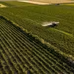 Agriculture land being fumigated by a tractor. Photo: Pixabay.