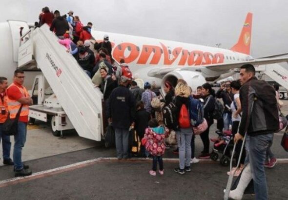 Passengers boarding a Venezuela's state owned Conviasa flight. The Venezuelan government has repatriated thousands of Venezuelans with the Vuelta a la Patria program. File photo.