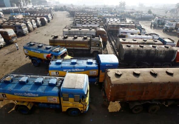 Oil tanker trucks parked at a yard outside a fuel depot on the outskirts of Kolkata, West Bengal, India. Photo: Reuters/Rupak De Chowdhuri.