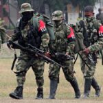 Five ELN guerilla fighters walking in formation while heavily armed. File photo.