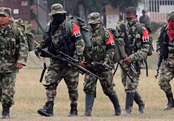 Five ELN guerilla fighters walking in formation while heavily armed. File photo.