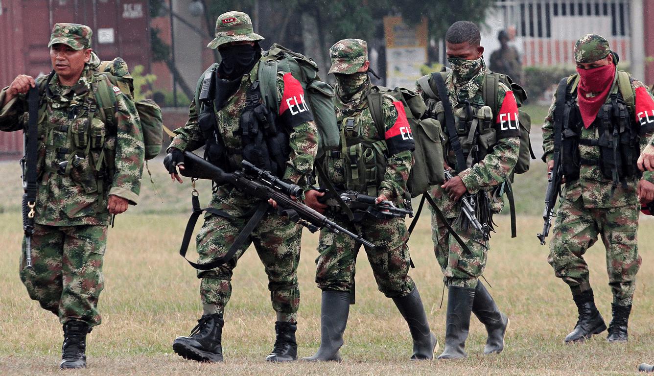 Five ELN guerilla fighters walking in formation while heavily armed. File photo.