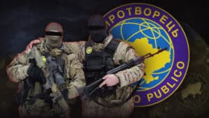 Photographic composition that shows two uniformed Ukrainians with their eyes crossed out in front and the symbol of the Mirotvorets organization in the background. File photo.