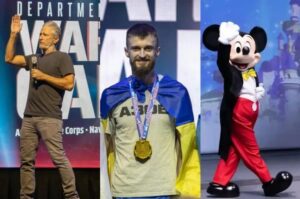 US comedian Jon Stewart (left), Ukrainian neo-nazi Ihor Halushka (center), and a person in cartoon costume (right) at the US Department of Defense Warrior Games 2022 in Disney World, Florida, USA. Photo composition: The Grayzone.