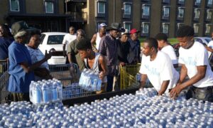 Community water distribution in Jackson, Mississippi. Photo: AP/Steve Helber.