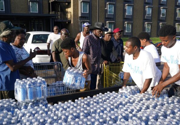 Community water distribution in Jackson, Mississippi. Photo: AP/Steve Helber.