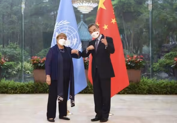 UN High Commissioner for Human Rights Michelle Bachelet (left) and Chinese Foreign Minister Wang Yi (right) during Bachelet's trip to China. Photo: Deng Hua/AP.
