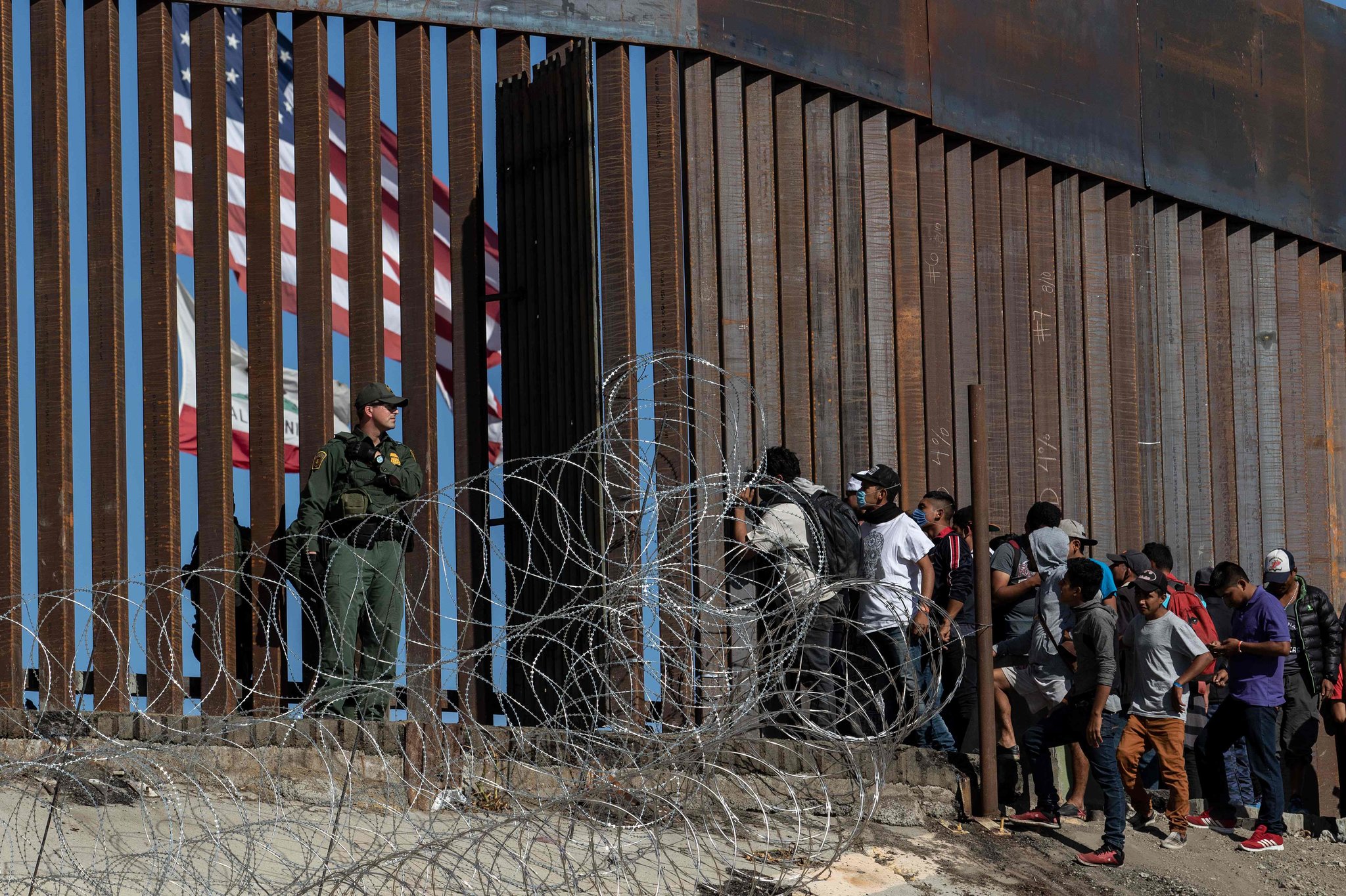 Migrants at a border crossing of the US southern border near Tijuana, Mexico, in 2018. Photo: Guillermo Arias/AFP.