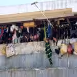 Prisoners look out from between bars at the National Penitentiary in Port-au-Prince, Haiti. Photo: Dieu Nalio Chery