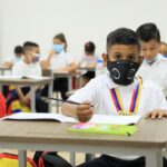 Elementary school students in a classroom wearing face masks. File photo.