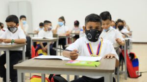 Elementary school students in a classroom wearing face masks. File photo.