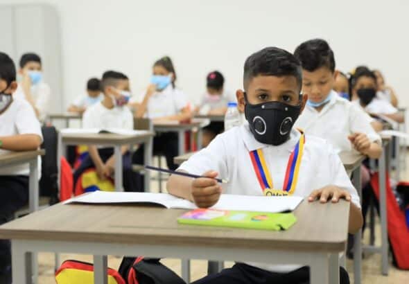 Elementary school students in a classroom wearing face masks. File photo.