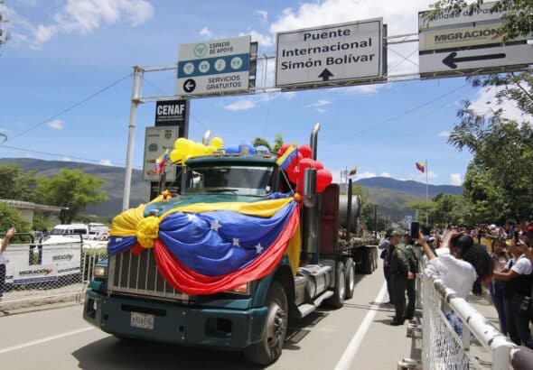 A truck crosses the Simón Bolívar bridge from Venezuela to Colombia during the border reopening ceremony, in Cúcuta. Photo: Mario Caicedo/EFE.
