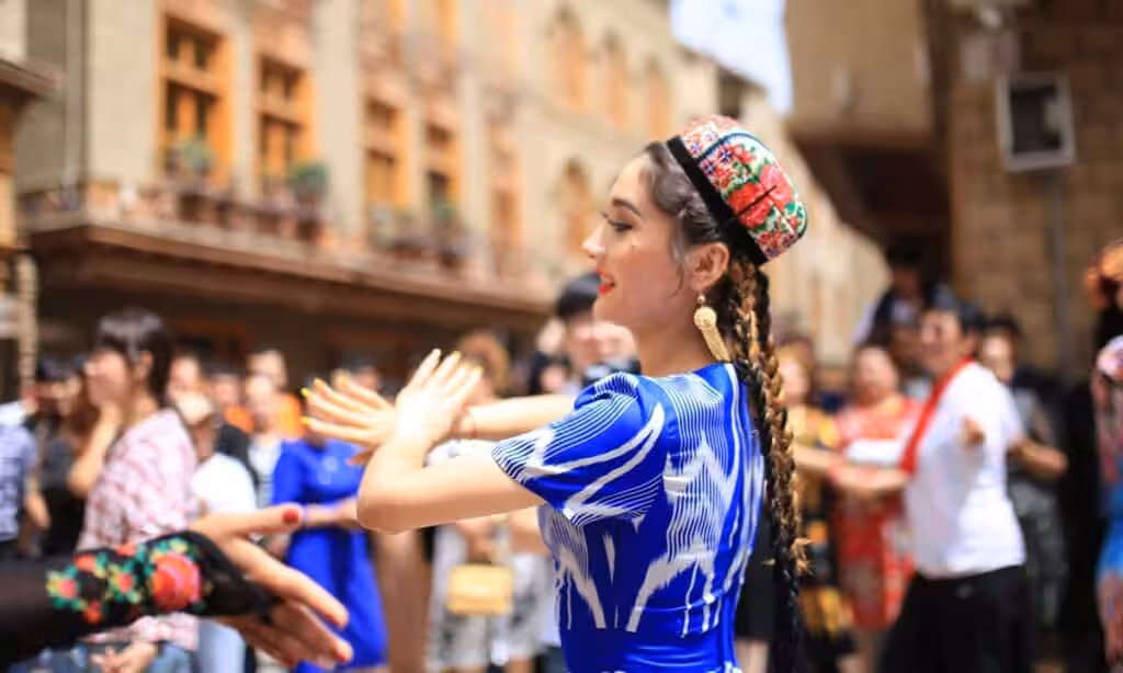 Local residents in Tuancheng of Hotan Prefecture dance for the Corban Festival. Photo: Liu Xin/GT