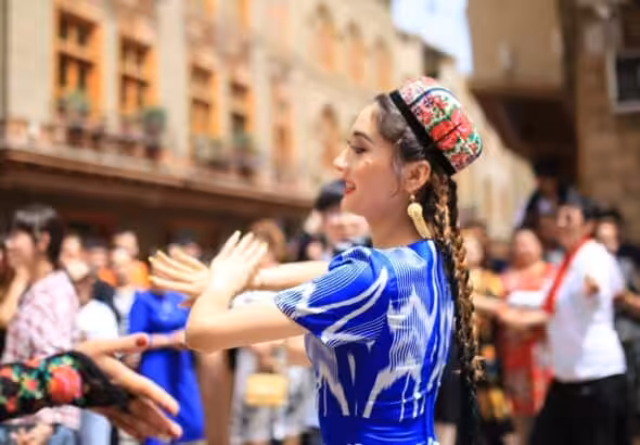 Local residents in Tuancheng of Hotan Prefecture dance for the Corban Festival. Photo: Liu Xin/GT