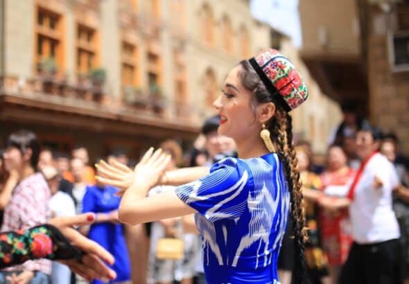 Local residents in Tuancheng of Hotan Prefecture dance for the Corban Festival. Photo: Liu Xin/GT