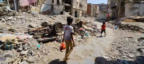 Children walk through a damaged part of downtown Craiter in Aden, Yemen. The area was badly damaged by airstrikes in 2015 as the Houthi’s were driven out of the city by coalition forces. Photo: Giles Clarke/OCHA.
