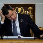 Fake president Juan Guaidó with his head in his hand. File photo.