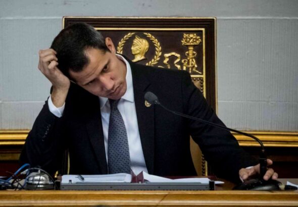 Fake president Juan Guaidó with his head in his hand. File photo.