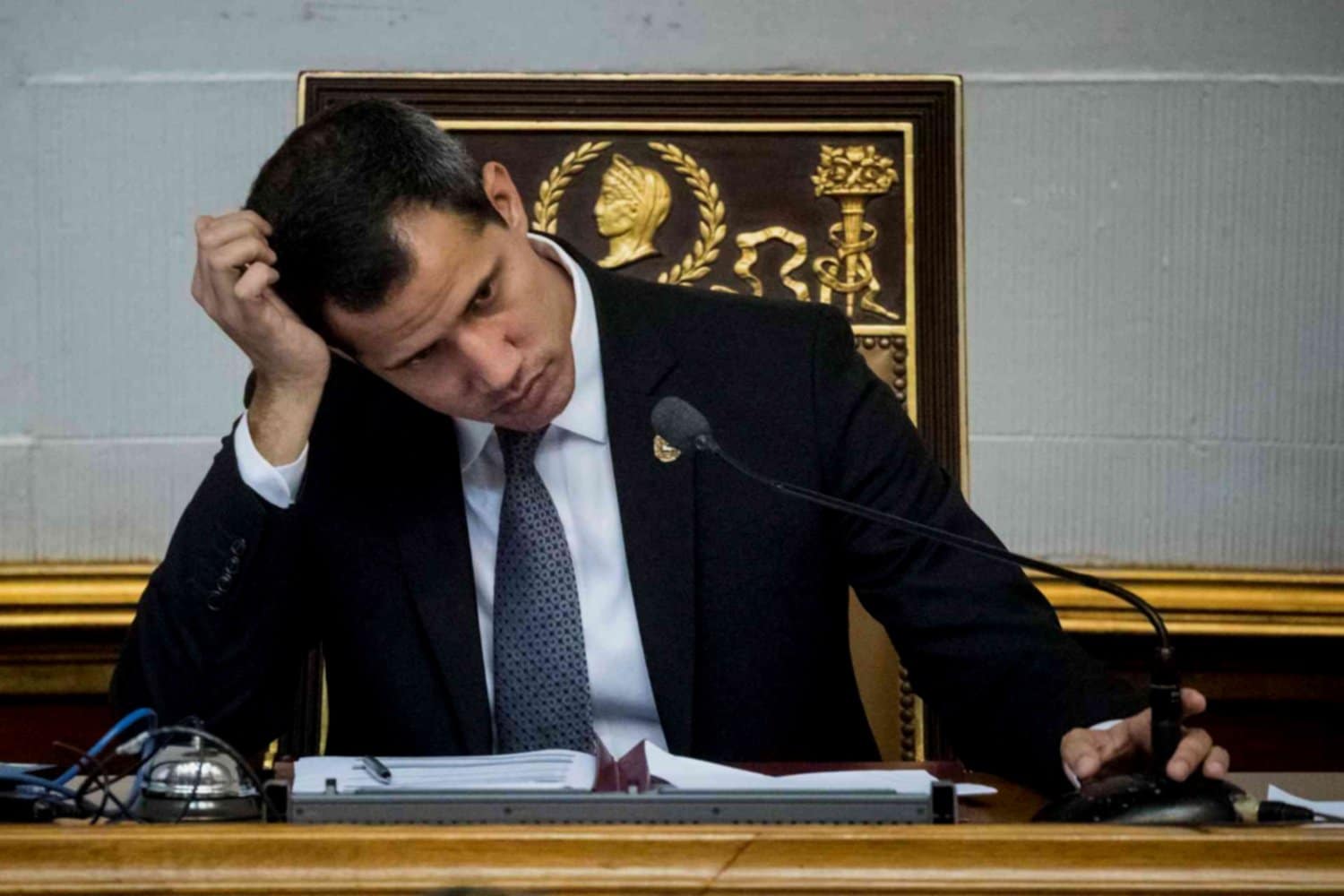Fake president Juan Guaidó with his head in his hand. File photo.