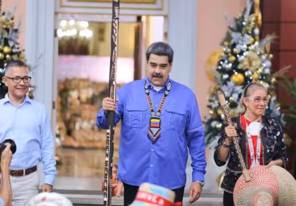 Venezuelan President Nicolas Maduro (center) flanked by Minister for Culture Ernesto Villegas (left) and his wife and Deputy Cilia Flores (right), during a meeting with indigenous leader at Miraflores Palace, Caracas, during the Indigenous Resistance Day. Photo: Presidential Press.