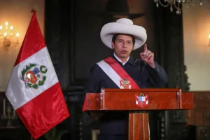President Castillo standing at the presidential podium. On December 7, Castillo was removed from the presidency by Congress and replaced by his VP Dina Boluarte. File photo.