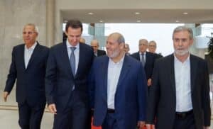 Syrian President Bashar al-Assad walks next to Khalil al-Hayya, Hamas politburo member, during the most recent Hamas visit to Damascus last Wednesday, October 19, 2022. Photo Syria News.