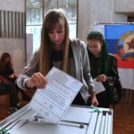 A girl votes in a referendum on the accession of the Luhansk People's Republic to Russia at a polling station. Photo: Sputnik/Evgeny Biyatov.