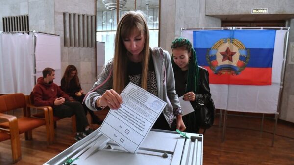 A girl votes in a referendum on the accession of the Luhansk People's Republic to Russia at a polling station. Photo: Sputnik/Evgeny Biyatov.