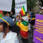 People protesting with the Ethiopian flag and banners in hand that read: "No more wrong policies and sanctions against Ethiopia and Eritrea." Photo: Black Agenda Report.