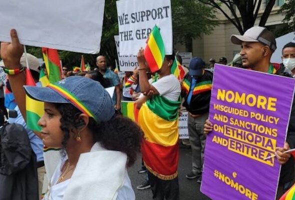 People protesting with the Ethiopian flag and banners in hand that read: "No more wrong policies and sanctions against Ethiopia and Eritrea." Photo: Black Agenda Report.