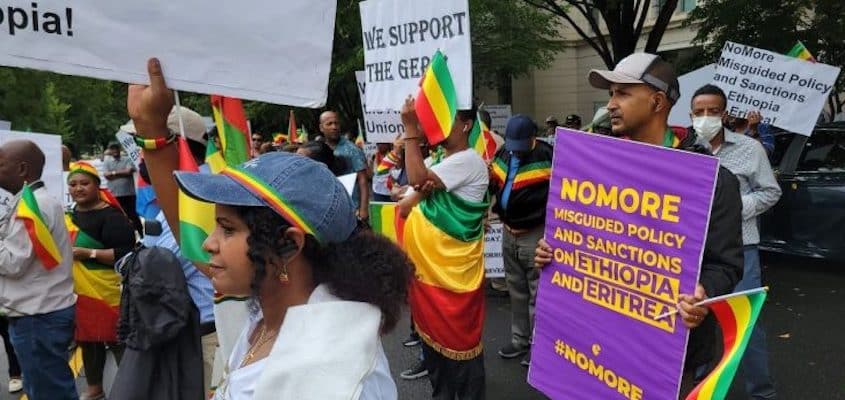 People protesting with the Ethiopian flag and banners in hand that read: "No more wrong policies and sanctions against Ethiopia and Eritrea." Photo: Black Agenda Report.