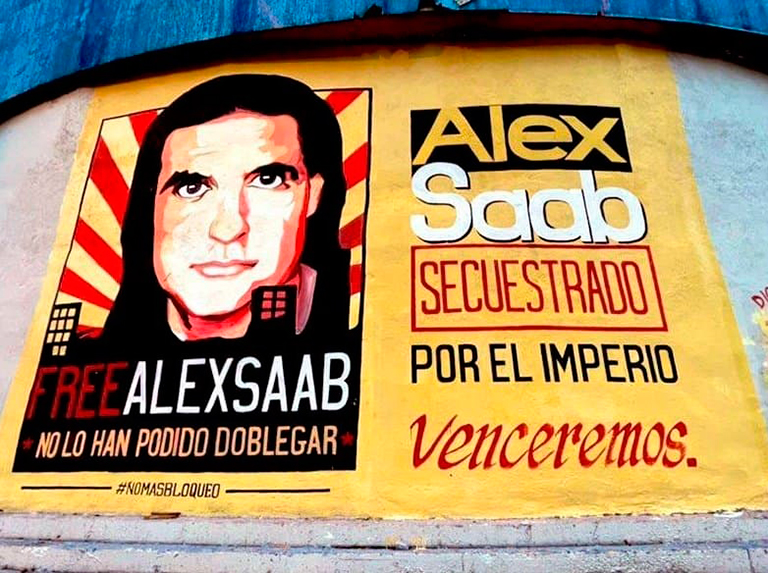 Poster in a street of Caracas with the face of Alex Saab and the following text: “FreeAlexSaab, you have not been able to bend him. Alex Saab was kidnapped by the empire,Venceremos!” Photo: William Camacaro.