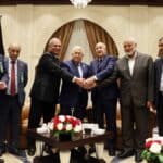 Palestinian president Mahmud Abbas (center) meets Algerian President Abdelmajid Tebboune (center right) and Palestinian Hamas movement's leader Ismail Haniyeh (2nd right) in Algiers, Algeria, on July 5, 2022. Photo: Thaer Ghanaim/AFP/Handout/PPO.