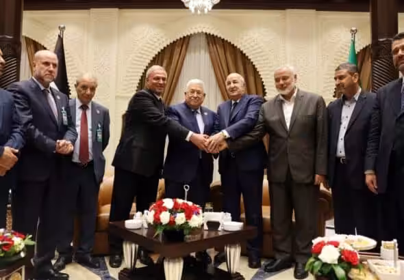 Palestinian president Mahmud Abbas (center) meets Algerian President Abdelmajid Tebboune (center right) and Palestinian Hamas movement's leader Ismail Haniyeh (2nd right) in Algiers, Algeria, on July 5, 2022. Photo: Thaer Ghanaim/AFP/Handout/PPO.
