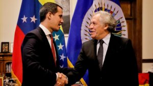 Coup plotter Juan Guaidó (left) shakes hands with OAS Secretary General Luis Almagro (right). File photo.