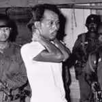 An Indonesian Communist Party member being led to his execution by Indonesian soldiers, in 1965. Photo: National Security Archive/The George Washington University.