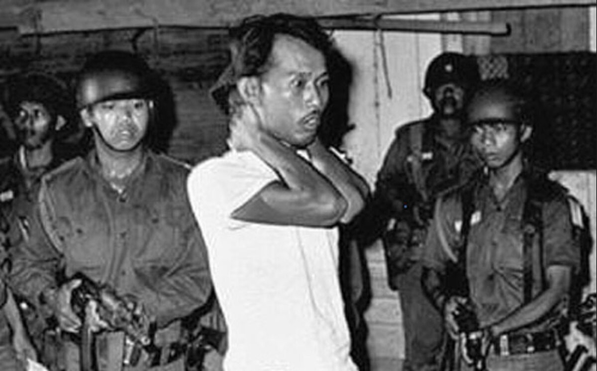 An Indonesian Communist Party member being led to his execution by Indonesian soldiers, in 1965. Photo: National Security Archive/The George Washington University.