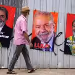 A man walks past merchandise showing Lula's face, in Brasilia, Brazil, on September 20, 2022. Photo: AP.