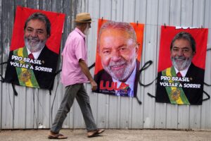 A man walks past merchandise showing Lula's face, in Brasilia, Brazil, on September 20, 2022. Photo: AP.