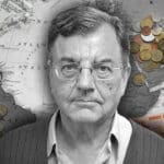 Photo Composition with Professor Michael Hudson (center), in the background, US dollars bills and coins over a map of America on the left and Russian Ruble bills and coins on the right. Photo: The Cradle.